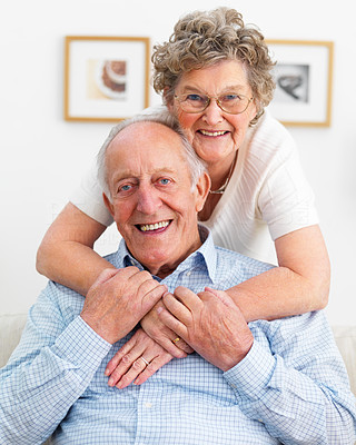 Closeup of a smiling senior couple hugging