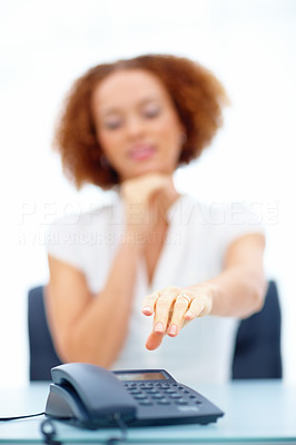 Business woman reaching for the phone