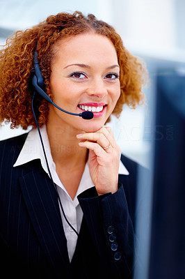 Business woman with headset working on computer in office