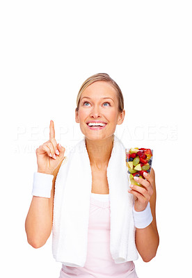 Health concepts - Healthy young woman pointing upwards