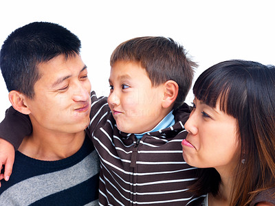 Asian family making funny faces on white
