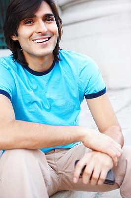 Closeup of a young man sitting on steps