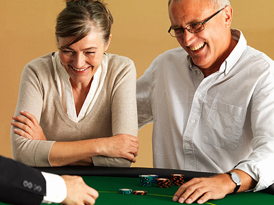 Mature couple gambling at casino