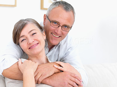 Happy old couple at home with copy space