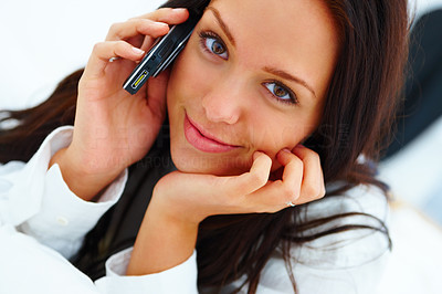 Happy young woman lying calling on mobile phone