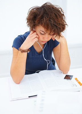 Student listening to music and studying