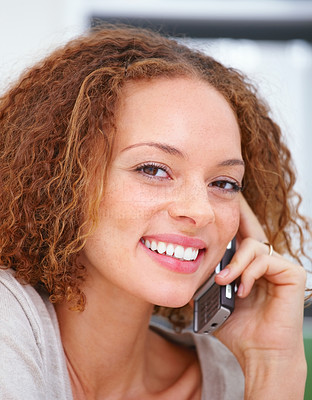 Portrait of a young woman using cell phone