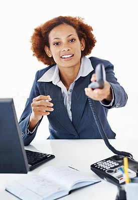 Business woman holding out telephone receiver