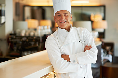 Smiling cook with arms crossed