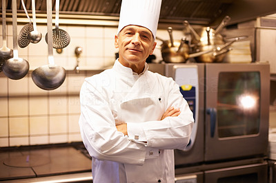 Smiling male chef in commercial kitchen