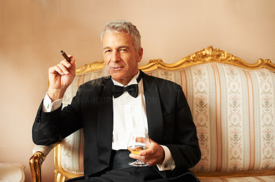 Handsome man with cigar and brandy