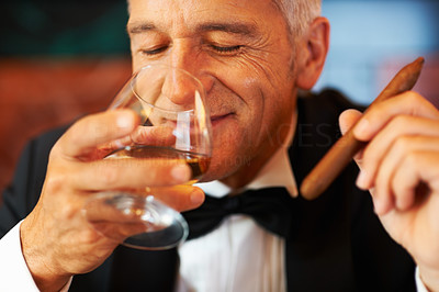 Happy man with cigar and brandy