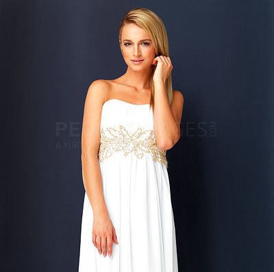 Elegant fashion model wearing white evening gown