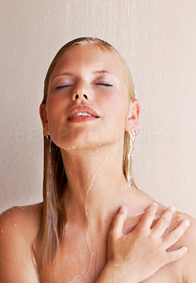 Relaxed young woman enjoying shower