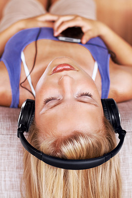 Relaxed young girl listening to music