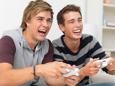 Closeup portrait of two friends playing video game