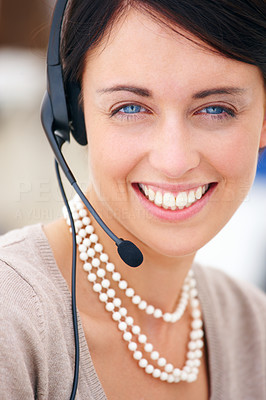 Portrait of a happy young lady with headset