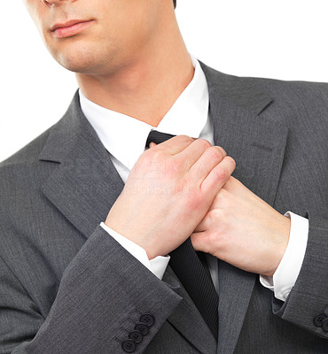 Close up portrait of a business man adjusting tie
