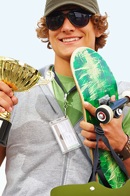 Young guy holding skateboard and cup