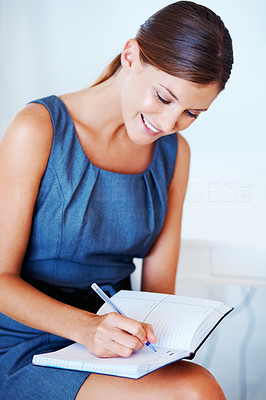 Business woman writing notes