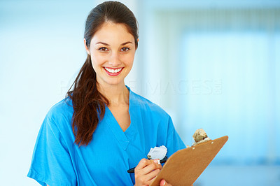 Young female doctor taking notes