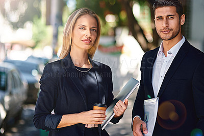 Buy stock photo Portrait of two confident coworkers standing together outside