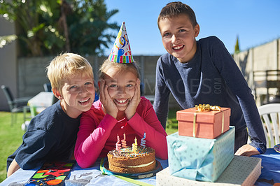 Buy stock photo Portrait of a group of young children enjoying an outdoor birthday party