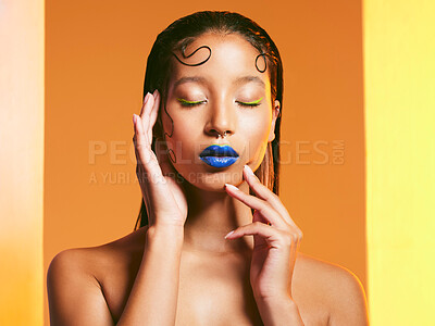 Buy stock photo Studio shot of a beautiful young woman wearing blue lipstick