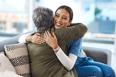 Buy stock photo Cropped shot of an attractive young female nurse embracing her senior patient