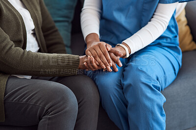 Buy stock photo Cropped shot of an unrecognizable nurse and a senior patient holding hands in comfort