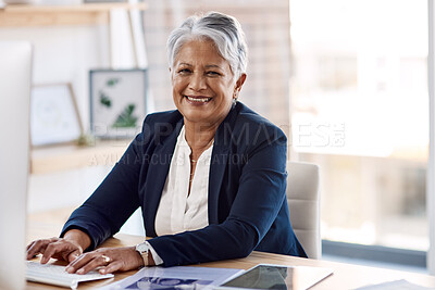Buy stock photo Cropped portrait of an attractive mature businesswoman working on her computer