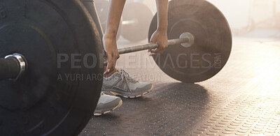 Buy stock photo Closeup shot of an unrecognisable woman exercising with a barbell in a gym