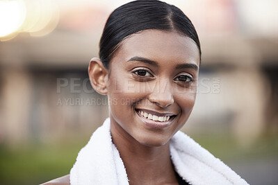 Buy stock photo Portrait of a sporty young woman taking a break while exercising outdoors