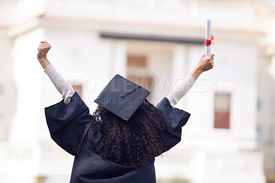Buy stock photo Rearview shot of a young woman cheering on graduation day