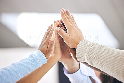 Buy stock photo Shot of a group of business people high fiving one another