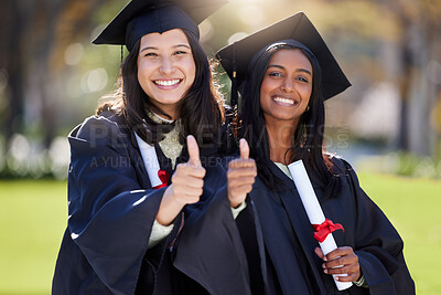 Buy stock photo Cropped portrait of two attractive young female students celebrating on graduation day