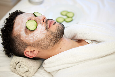 Buy stock photo Shot of a handsome young man enjoying a facial at a spa
