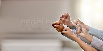 Buy stock photo Shot of a group of unrecognizable businesspeople holding up their fists at work