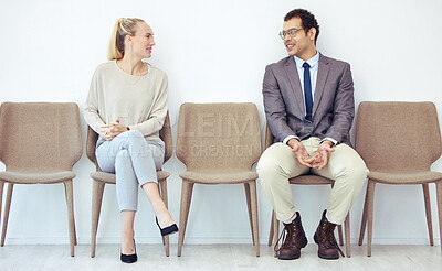 Buy stock photo Shot of two businesspeople sharing a laugh in a office