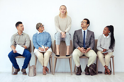 Buy stock photo Shot of a group of people waiting to be interviewed for a job at a modern office
