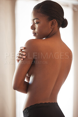 Buy stock photo Shot of a beautiful young woman posing topless in her bedroom