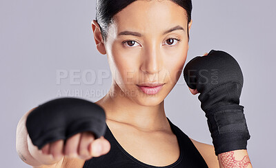 Buy stock photo Shot of an attractive young woman standing and posing during her workout