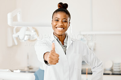 Buy stock photo Shot of a young female dentist giving the thumbs up