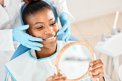 Buy stock photo Shot of a patient checking her dental work