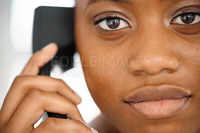 Buy stock photo Shot of a young woman on a call at work