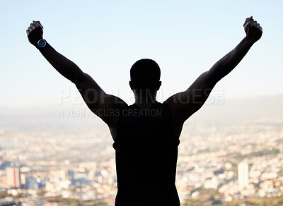 Buy stock photo Shot of an unrecognisable man standing alone outside and feeling successful after exercising