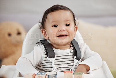 Buy stock photo Shot of a baby playing with blocks at home