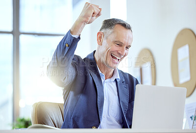 Buy stock photo Shot of a mature businessman cheering while using a laptop in an office at work