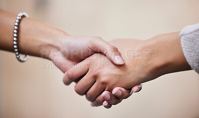 Buy stock photo Shot of two businesswomen shaking hands in greeting