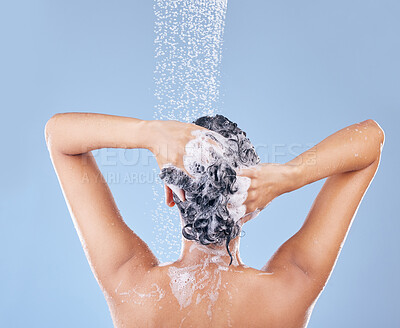 Buy stock photo Shot of an unrecognisable woman washing her hair